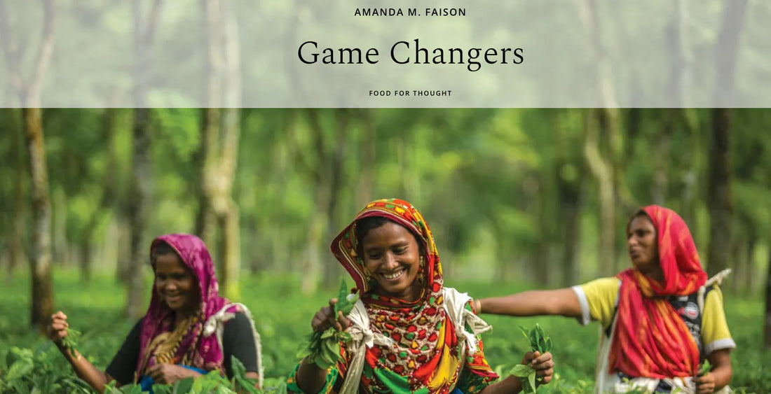 Women working in a lush green field, embodying the spirit of GAME CHANGERS in sustainable agriculture.